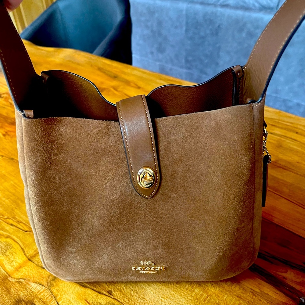Suede Coach bag purchased in fall.  Used twice  excellent condition.